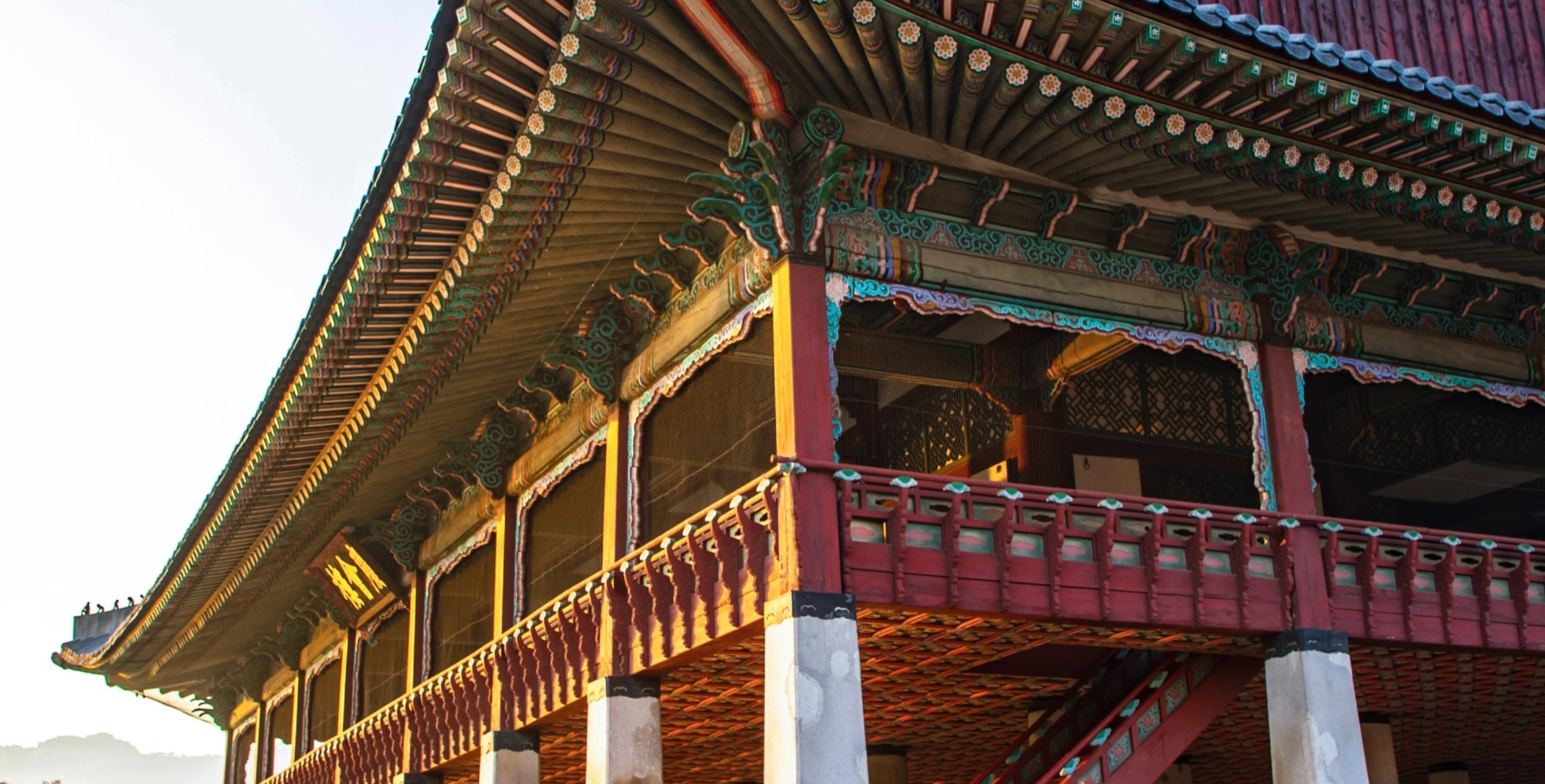 Traditional Korean architecture with ornate eaves, symbolizing the ancient cultural roots of holistic K-beauty rituals.